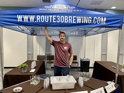 Eric Brummel, co-owner of Route 30 Brewing Company, at beer tasting table